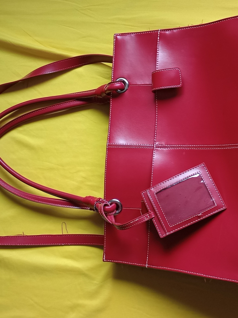 Black Rivet brand tote bagade of genuine leather